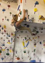 woman on bouldering wall