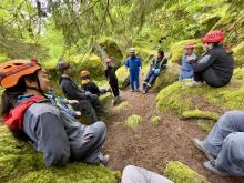 group of people in safety gear having a discussion