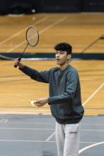 Man playing badminton.
