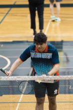 Man playing badminton.