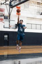Man playing basketball.