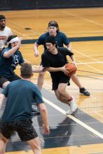 Men playing basketball.