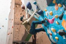 Man climbing a bouldering wall.