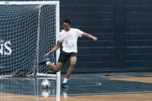 Man playing soccer.
