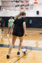 Girl playing soccer.