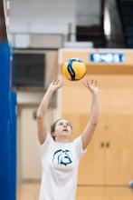 Girl playing volleyball.