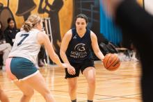 Women playing basketball.