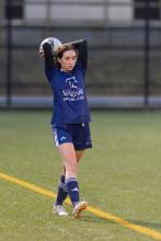 Girl playing soccer.