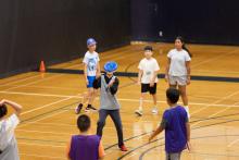 A kid catching a frisbee
