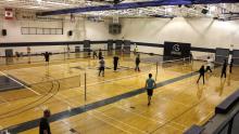 people playing badminton in the Gym