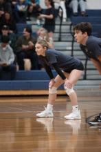 People playing volleyball in the gym