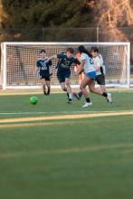 People playing soccer outside