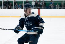 Person playing hockey at the rink