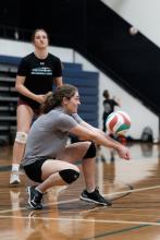 People playing volleyball in the gym