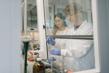 Two students doing experiment in Chemistry lab