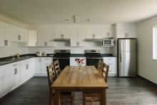 a photo of kitchen and dining area in DeVries centre