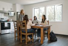students sitting around a table in DeVries Centre