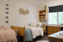 Robson Hall residence room with two beds, desks and a window.