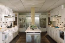 Robson Hall kitchen with multiple cooking stations and a central island.