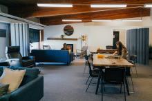 Students relaxing and studying in the lounge area at The Well.
