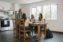 students sitting around a table in DeVries Centre