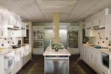 Robson Hall kitchen with multiple cooking stations and a central island.