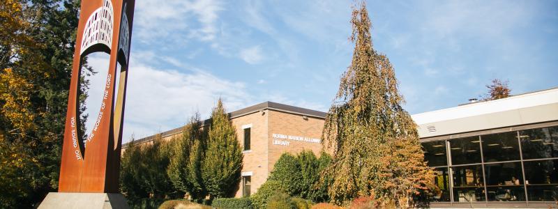 Photo of the outside of the Library and bell tower. Langley campus.