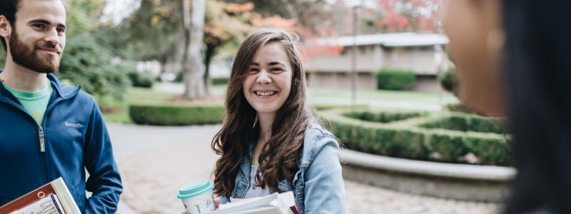 Students talking on campus.