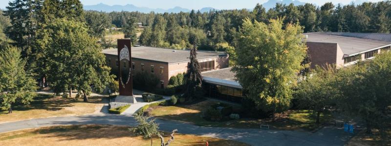 Drone shot of the Langley campus library and bell tower.