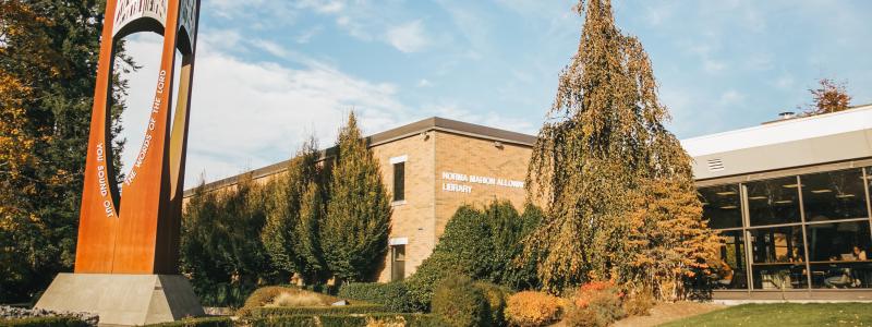 Photo of the outside of the Library and bell tower. Langley campus.
