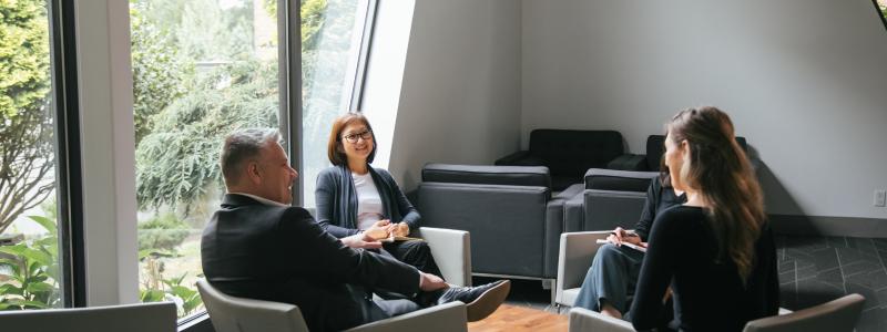 employees chatting in Commons