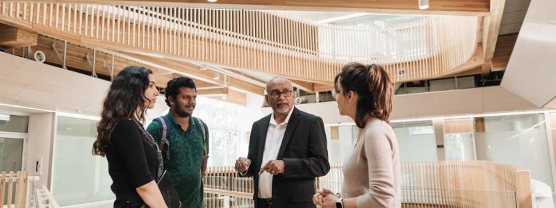 people talking in Kuhn Centre atrium