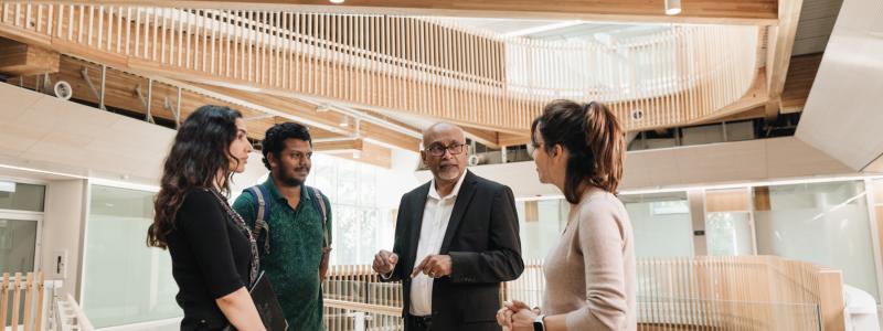 group of people talking in Kuhn Centre