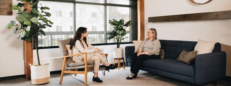 two people having a seated conversation 