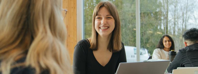 student leader smiling and talking