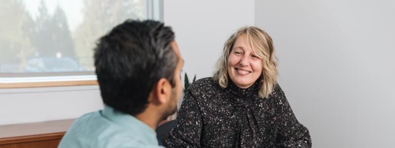 two people having a seated conversation 