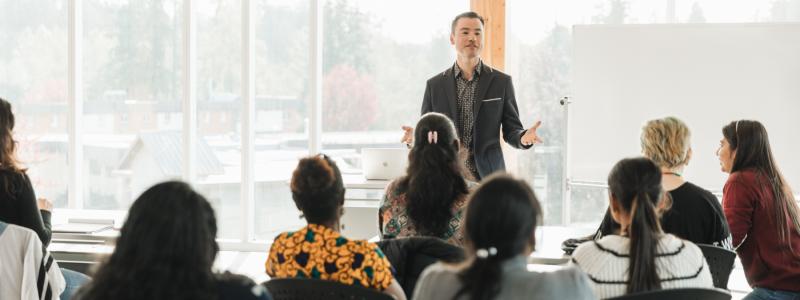 international students in classroom learning from professor