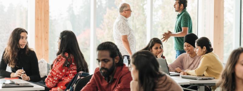 international students in classroom learning from professor