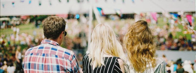 people looking at a tent
