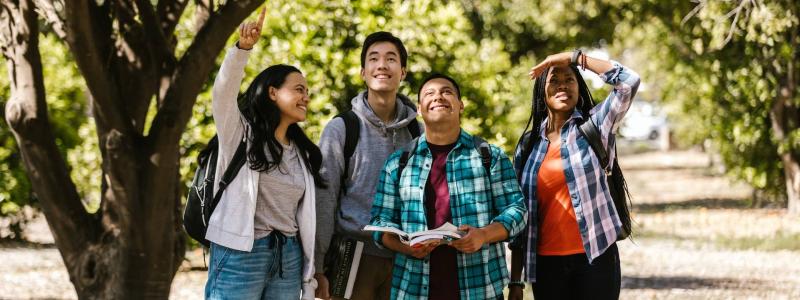 people looking up and pointing outside