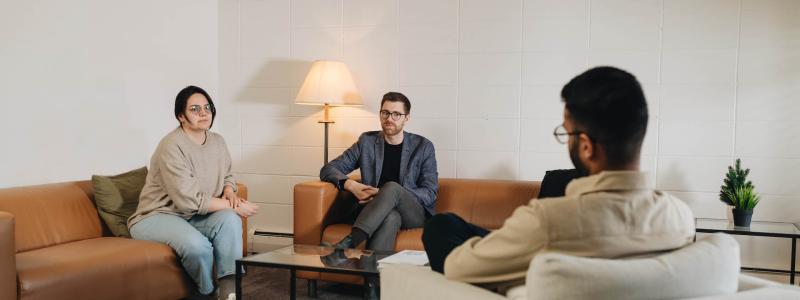 couple sitting talking with counsellor