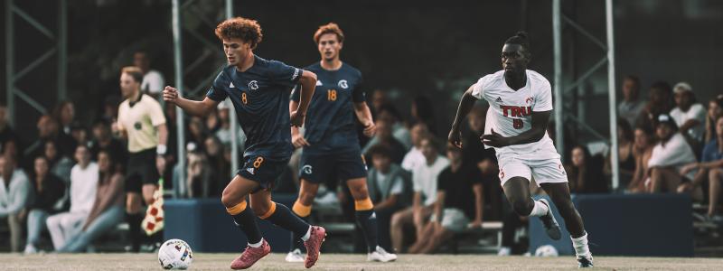 student athlete playing soccer on field