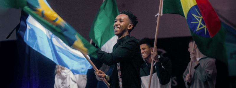 people waving flags from different countries