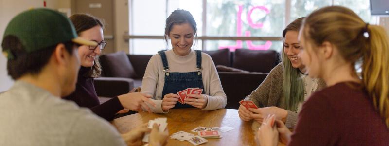 students playing cards at a table