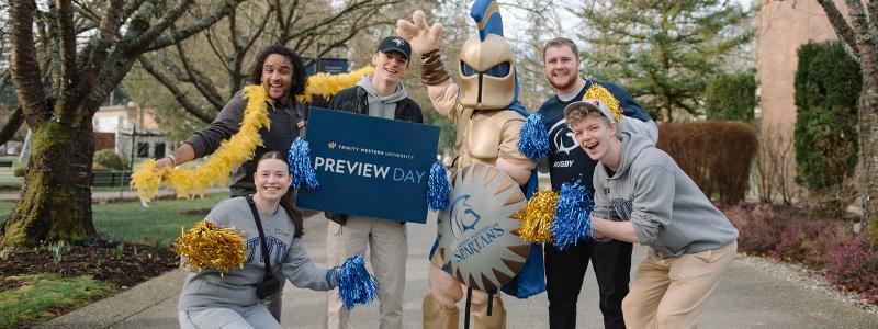 students at preview day smiling with sparty