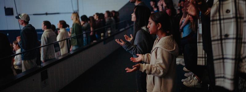 people singing in chapel
