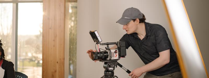 man working with with camera in Kuhn Centre