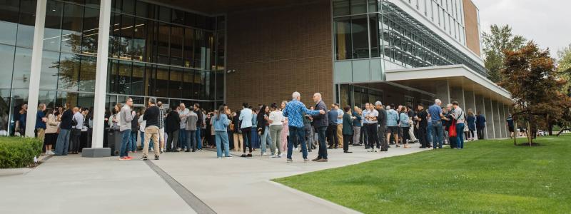 community day 2024 with employees standing in front of Kuhn Centre