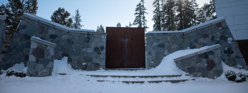 Outdoor chapel covered in snow.