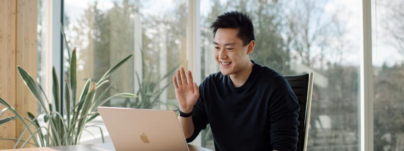 Student attending a virtual session on his computer.